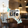 "Highlands Life" sticker with a turquoise lake outline and attribution.