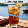Iced tea glass with Lake Rayburn design and lemon slice on a wooden table.