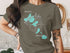 Green t-shirt with "Beautiful Madison Lakes Wisconsin" and compass graphic.