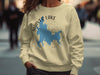 Cream sweatshirt with Shaver Lake California map and compass graphic.