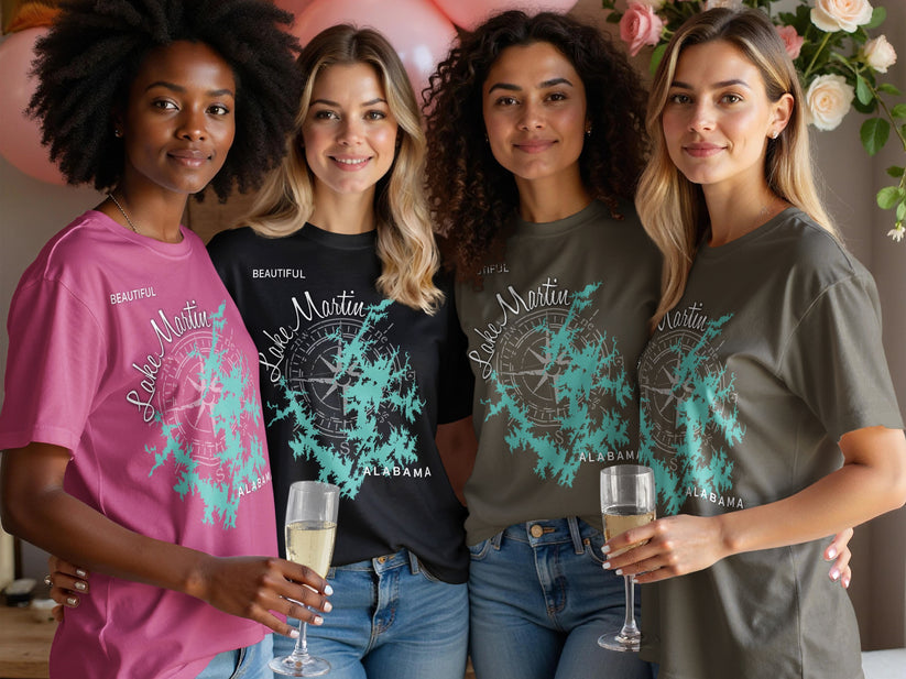Four women in t-shirts with "Beautiful Lake Martin Alabama" graphic and compass rose.