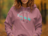 Rathbun Lake compass and Iowa map graphic on a rose pink hoodie.