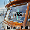 Sticker and text on a wooden boat window: Seneca Life, Lake Lodge Media.