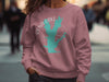 Mauve sweatshirt with turquoise Rend Lake map and compass design.