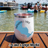 White insulated wine tumbler with Sandhill Lake Wisconsin graphic standing on a wooden boat dock.