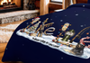 Dark blue blanket with winter fishing lodge Christmas scene and text.