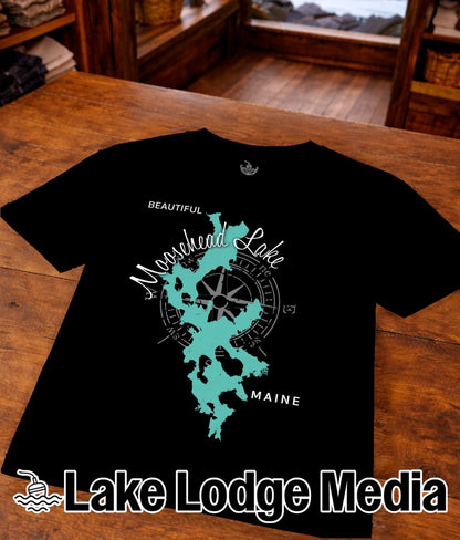 Black t-shirt with a turquoise map outline of Moosehead Lake, Maine.