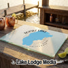 Glass cutting board featuring a blue Topaz Lake, California map design resting on a wooden dock.