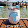 White insulated wine tumbler featuring a blue outline map of Lake Stevens, Washington, sitting on a wooden boat deck with people swimming in the lake.