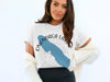 T-shirt with blue Onondaga Lake map graphic and compass rose, with "NEW YORK" text.