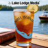Glass with Sanibel Island, Florida map and compass design, with iced tea.