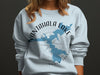 Light blue sweatshirt with Nantahala Lake map design and compass rose.