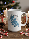 White mug with Webster Lake, Massachusetts map and compass design.
