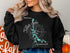 Black sweatshirt with map of Tellico Lake and compass rose graphic.