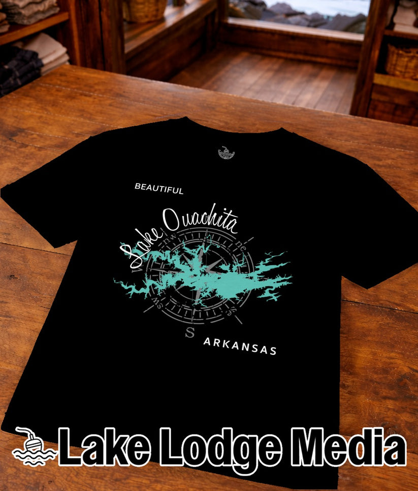 Black t-shirt with "Lake Ouachita" compass design and "Lake Lodge Media" logo.