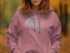 Rose pink hoodie with Falls Lake, North Carolina compass graphic.