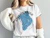 White t-shirt with blue Lake Istokpoga map and "Florida" text graphic.