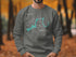 Crewneck sweatshirt with Nickajack Lake Tennessee map and compass graphic.