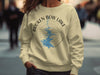 Crewneck sweatshirt with Broken Bow Lake, Oklahoma graphics and a compass rose.