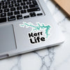 Turquoise Kerr Lake map sticker with black text "Kerr Life" on a laptop.