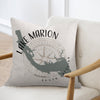 A square throw pillow with a Lake Marion, South Carolina map design rests on an armchair.