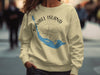 Cream sweatshirt with Sanibel Island Florida map and compass graphic.