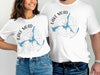 White t-shirts with "Lake Mead Arizona" text and a compass design featuring the lake shape.