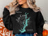 Black sweatshirt with Lake Keowee Georgia map and compass graphic.