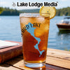 Glass of iced tea with blue lake graphic and compass design.