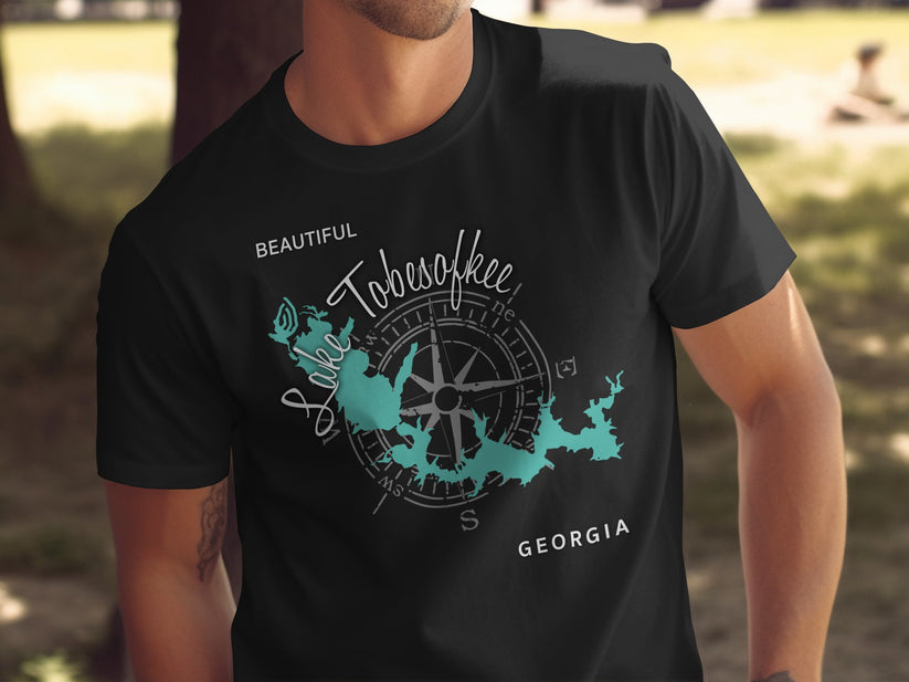 Black t-shirt featuring a teal map of Lake Tobesofkee, Georgia with compass.