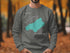 Grey sweatshirt with Lake Quinault map and compass design.