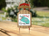 Sled ornament with "Merry Christmas From Round Valley Reservoir" text and snowflakes.