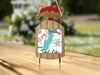 Sled ornament with "Merry Christmas From Trout Lake" text and snowflakes.