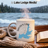White mug with Hayden Lake Idaho map and compass, steaming hot.