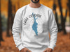White sweatshirt with Lake Cascade ID graphic and compass rose.