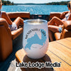 White insulated wine tumbler featuring a blue map design of Mendenhall Lake, Alaska, resting on a wooden boat table.