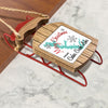 Sled ornament with "Merry Christmas From Cedar Creek Lake" and snowflakes.