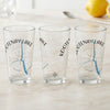 Three clear glasses with "Kootenay Lake Canada" text and a compass design.
