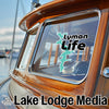 Lyman Life logo on a boat window next to "Lake Lodge Media" text.