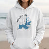 White hoodie with a blue Hayden Lake, Idaho map graphic and compass design.