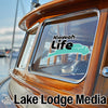 Kiawah Life logo on a boat window with Lake Lodge Media text.