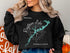 Black crewneck sweatshirt featuring a nautical compass and Raystown Lake map of Pennsylvania.