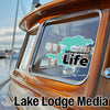 Turquoise Silverwood Life sticker on boat window with Lake Lodge Media logo.