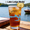 Glass of iced tea with a lemon slice and "Lake Spivey" text on a dock.
