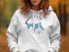 White hoodie with Rangeley Lake Maine map and compass logo design.
