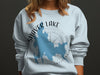 Light blue sweatshirt with Shaver Lake California map and compass graphic.