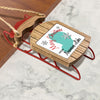 Wooden sled ornament with Merry Christmas and Neumanns Lake text.