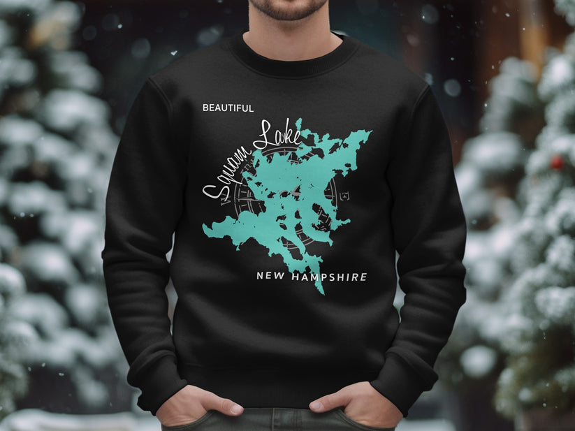 Black sweatshirt with a teal map outline of Squam Lake, New Hampshire.