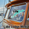 American Life decal on a boat window with Lake Lodge Media logo below.