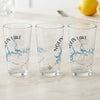 Three clear glasses feature "Nolin Lake" and a compass rose with a blue lake map design.